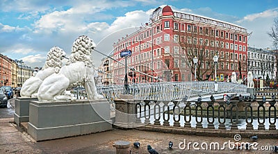 White sculptures of lions on the Lion Bridge over the Griboyedov Canal in St. Petersburg. Caption: Lion Bridge Editorial Stock Photo