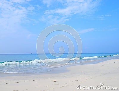 White Seashore, Blue Open Sky & Waves in Infinite Ocean - Radhanagar Beach, Havelock Island, Andaman & Nicobar Islands, India Stock Photo
