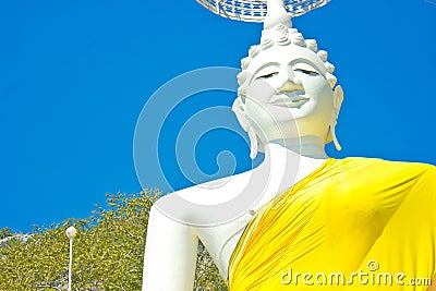White Seated Buddha image and blue sky in the Thai temple Stock Photo