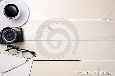 White set. Pen, eyeglasses, coffee and notebook on table. Top view. Stock Photo