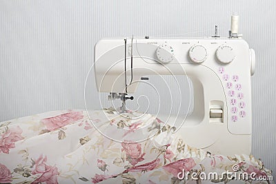 White sewing machine. Lightweight Tulle Curtain Fabric Stock Photo