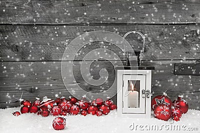 White shabby chic latern for christmas with candle and red balls Stock Photo
