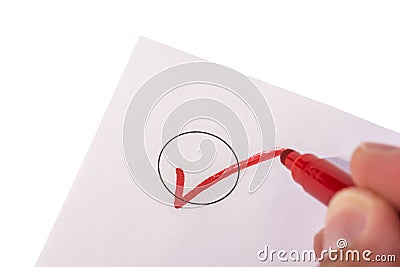 Checking a circle on an isolated piece of paper Stock Photo