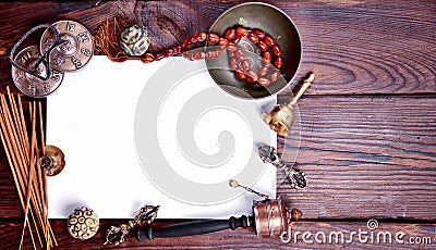 White sheet of paper among musical religious instruments Stock Photo