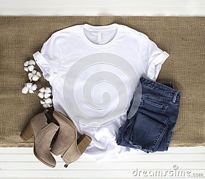 White shirt mockup - tshirt with cotton plant, burlap, boots & jeans Stock Photo