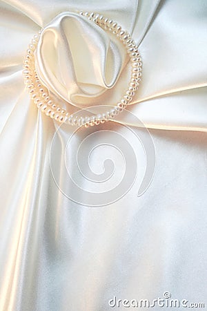 White silk with pearls as wedding background Stock Photo