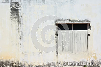 White simple vintage window with awning on grunge cement wall background Stock Photo