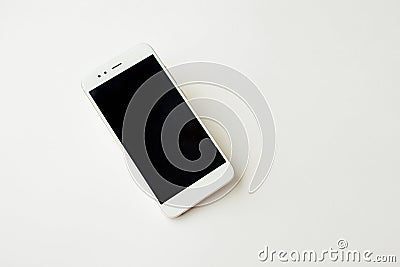 White smartphone on white background mockup. Phone, modern technologies social networks and applications. Stock Photo