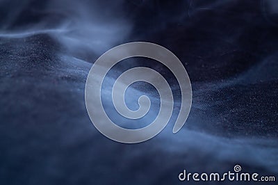 White smoke on black fabric background. Smoke spreads over the background. Vaping culture, life without cigarettes Stock Photo