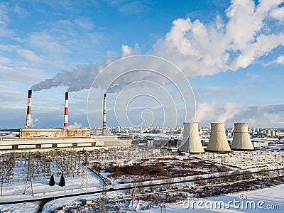 white smoke from the chimney against the blue sky Editorial Stock Photo
