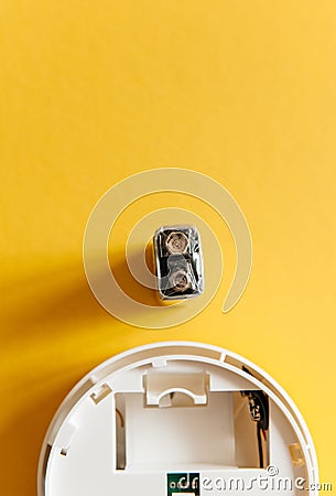 White smoke detector with nine volt battery Stock Photo