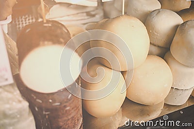 White and smoked scamorza in the basket, Italian typical cheese collection on the vitrine of market . French , Scamorze and Stock Photo