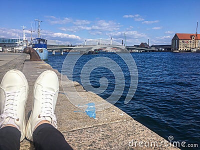 White sneakers on the background of the sea. Holidays in Europe. Stock Photo