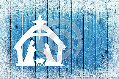 Blue Christmas background on wood table with Nativity scene and snowflakes Stock Photo