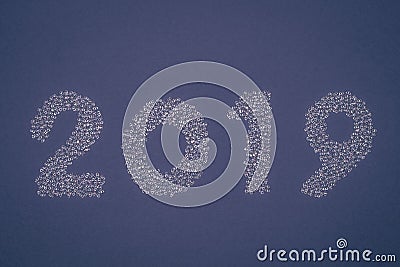 2019 of white sparkling strass decoration on blue background. Stock Photo