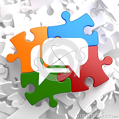 White Speech Bubble Icon on Multicolor Puzzle. Stock Photo