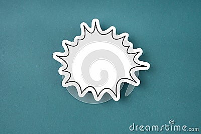 The White speech bubble shaped post it note on green background with copy space Stock Photo