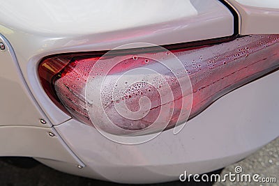 White sports car closeup. Condensation in taillights. Stock Photo