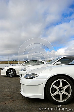 White sports cars at racetrack Stock Photo