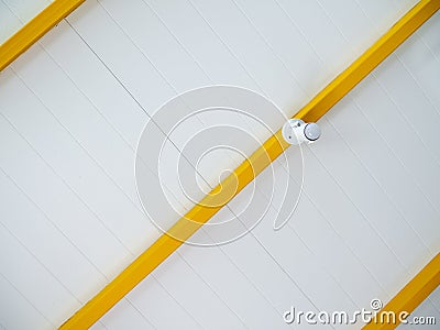 White spot LED light install on yellow edge on white ceiling Stock Photo