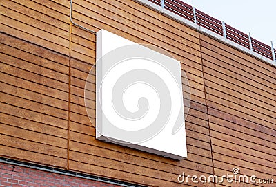 White square billboard on building wall for mockup, poster design presentation Stock Photo