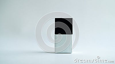 White square bottle with a black cap on a white background. Stock Photo