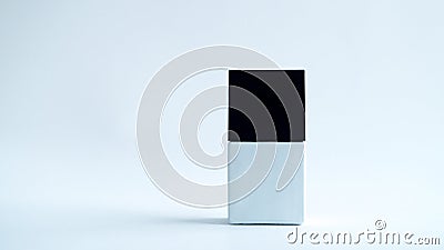 White square bottle with a black cap on a white background. Stock Photo