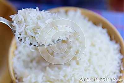 White steam rice on a spoon macro detail and background Stock Photo