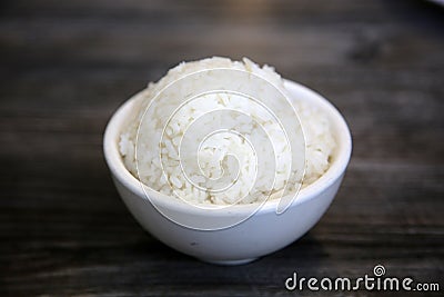 White steamed rice in a dish. Chinese Steamed Wite Rice in a white bowl. Chinese Lunch. White Rice Stock Photo