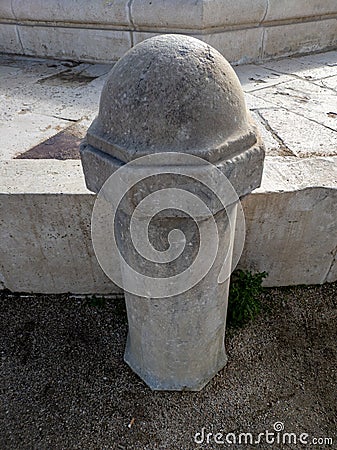 White stone bollard at sunset Stock Photo