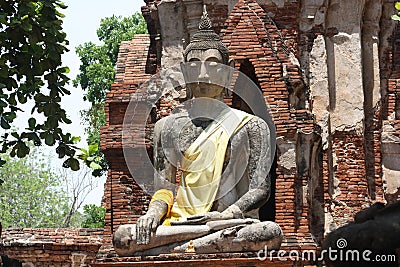 white stone sculpture of the seated figure of Buddha Stock Photo