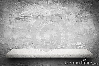 White stone shelf on bare concrete wall background Stock Photo