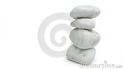 White stones balanced in tower, isolated on white background with soft shadow. Stock Photo