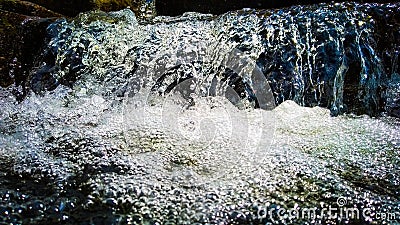 White stream water falling with white water bubbles Stock Photo