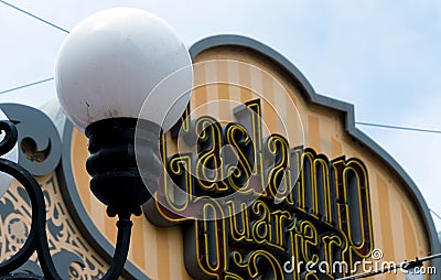 White street lamp glass ball in front of Gaslamp Quarter sign Editorial Stock Photo