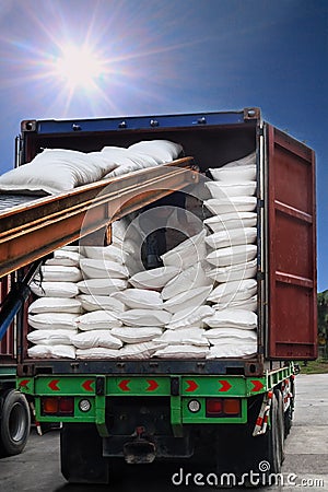 White sugar bags transferred to container for exporting Stock Photo