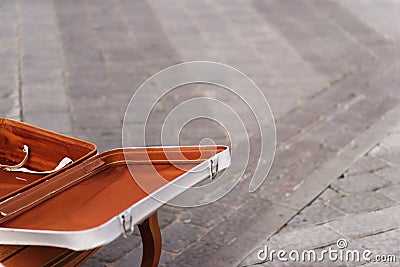 White suitcase on the pavement Stock Photo