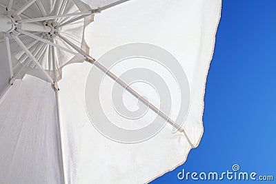 White sunshade on th background of blue sky Stock Photo
