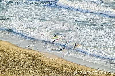 White surf and beach where surfer school sets out for surfing in Durban, South Africa on the Indian Ocean Stock Photo