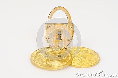 On a white surface, bitcoin and an open padlock. Stock Photo