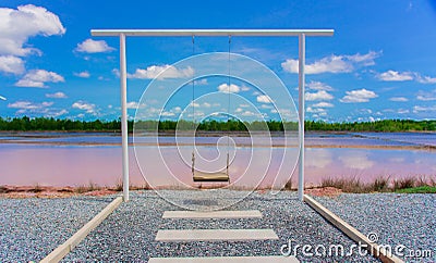 White swings on blue sky background Stock Photo