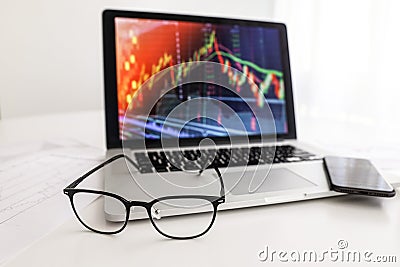 White table glasses coffee phone index growth chart Stock Photo