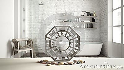 White table shelf with bagua and pebble stone, vintage bathroom with bathtub and shower, zen concept interior design, feng shui Stock Photo