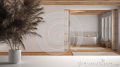 White table top or shelf with straws, dry plants, ornament, ears, sheaf, branch in vase, over japandi bathroom with freestanding Stock Photo