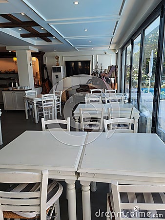 White tables and chairs in a cafe Stock Photo