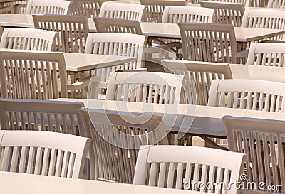 White tables and chairs on restaurant terrace Stock Photo