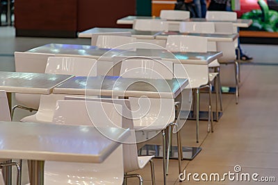 White tables are hardly in an empty cafe Stock Photo