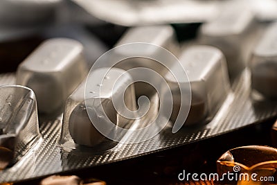 White tablets in a blister pack. Close up of medicinal pills. Vitamins, antibiotics, painkiller pharmaceuticals. Dose of Stock Photo