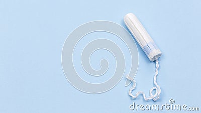 White tampon on the blue background, medical concept Stock Photo