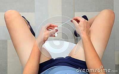 White tampon in hands of woman Stock Photo